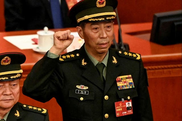 <p>Li Shangfu, China’s new defence minister, swears an oath after getting elected during the fourth plenary session of the National People’s Congress</p>