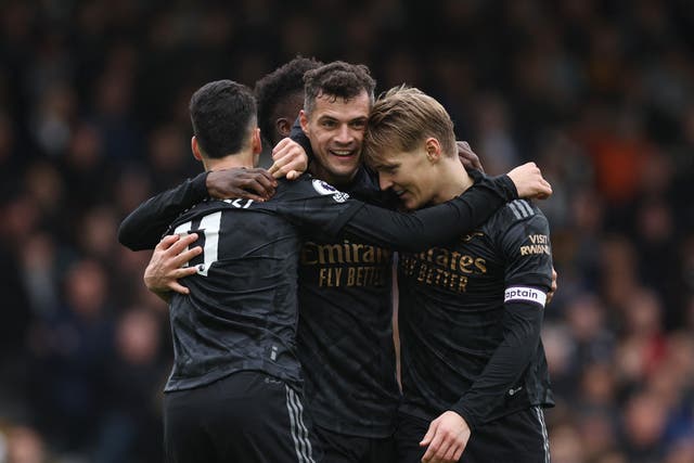 <p>Arsenal celebrate after scoring against Fulham</p>