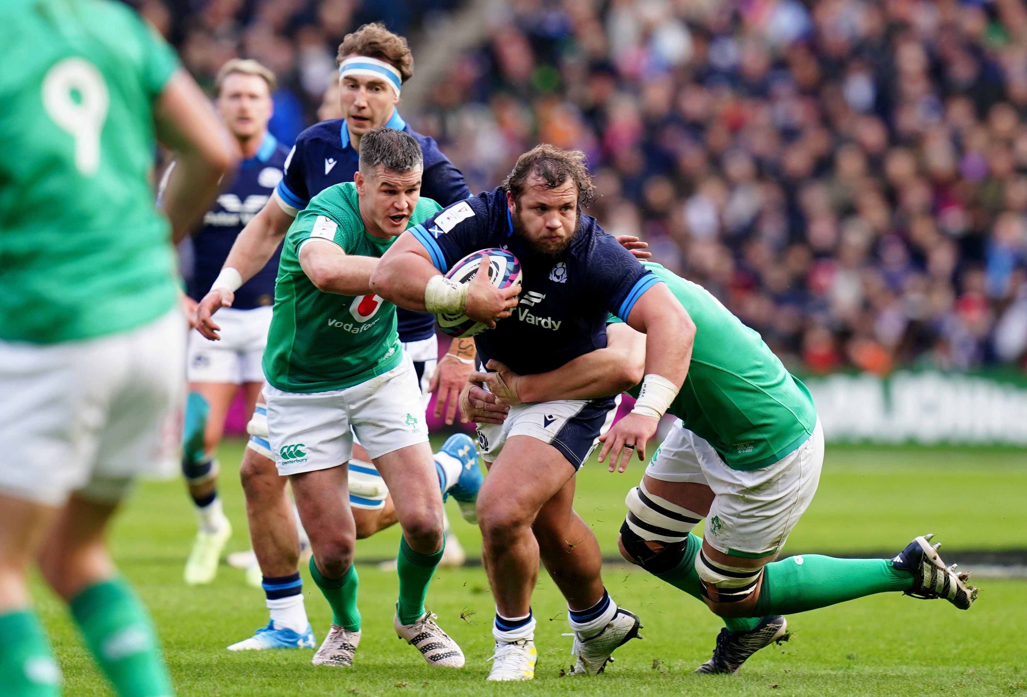 <p>Scotland’s Pierre Schoeman is challenged by two Irish players</p>