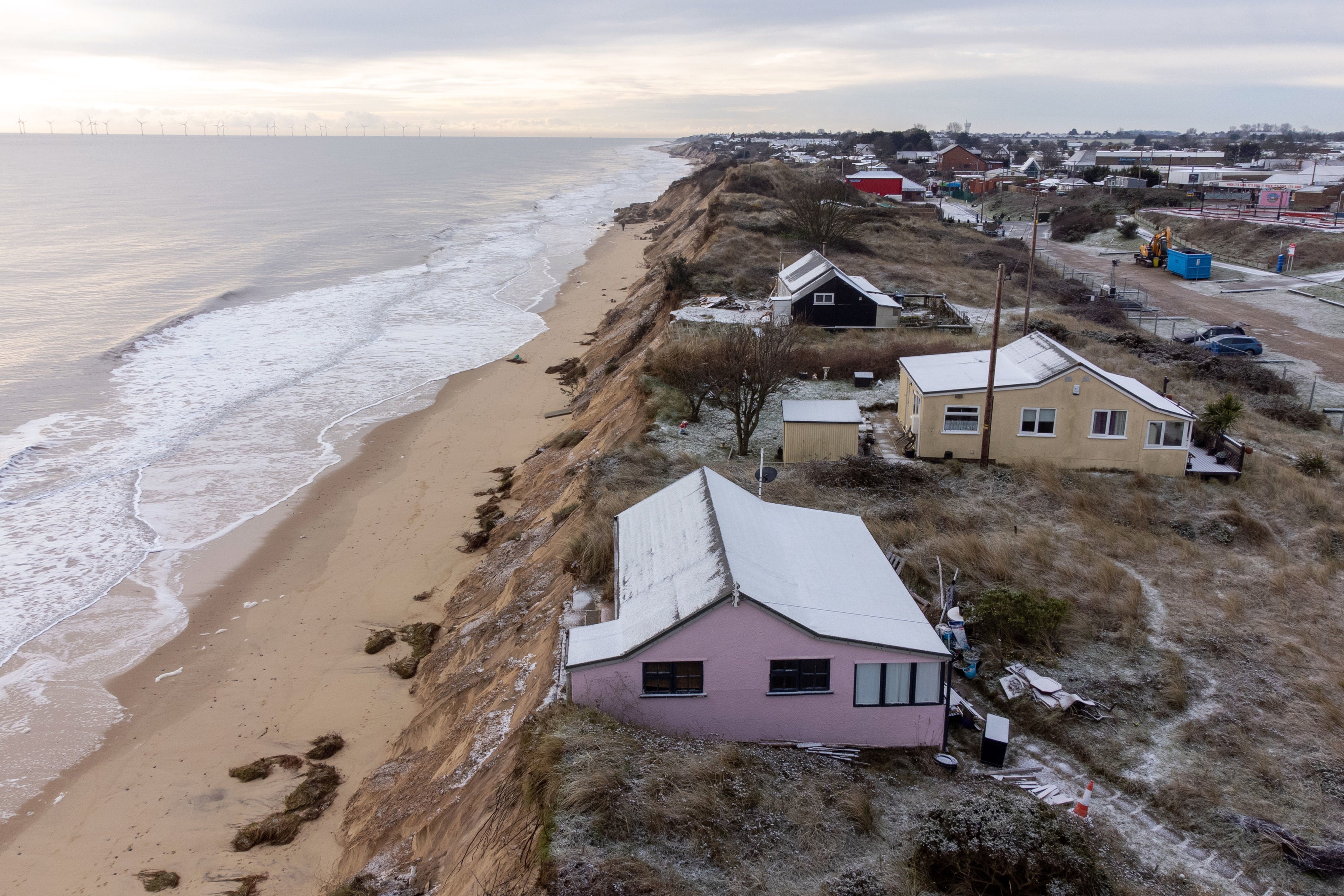 Houses close to the cliff edge at Hemsby in Norfolk pictured on Saturday