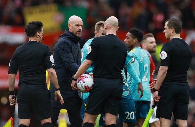 <p>Erik ten Hag confronts referee Anthony Taylor at full-time</p>