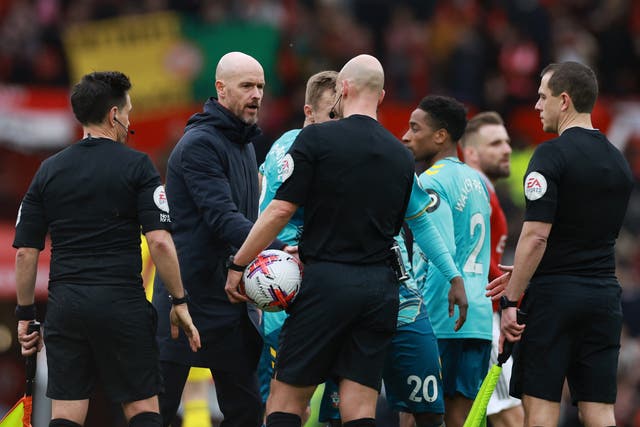 <p>Erik ten Hag confronts referee Anthony Taylor at full-time</p>