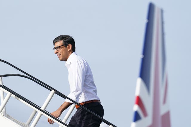 Prime Minister Rishi Sunak boards a plane at Stansted Airport (Stefan Rousseau/PA)