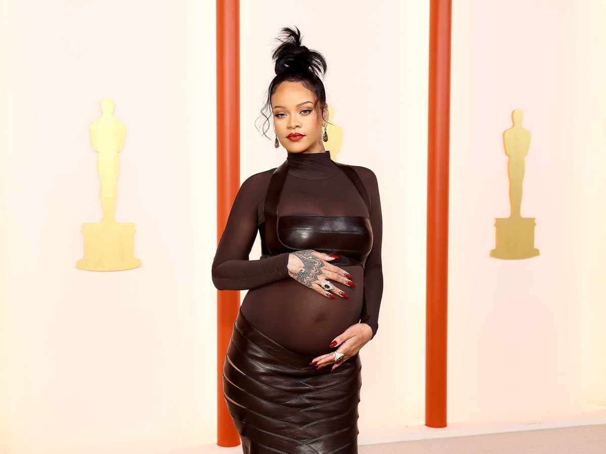 Rihanna arrives at Oscars 2023 in T-shirt, sneakers, and bucket hat: ‘She’s a mood’