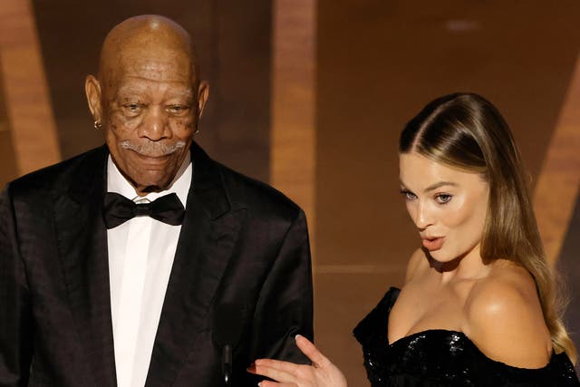 <p>Morgan Freeman and Margot Robbie speak onstage during the 95th Annual Academy Awards at Dolby Theatre on March 12, 2023 in Hollywood, California. (Photo by Kevin Winter/Getty Images)</p>