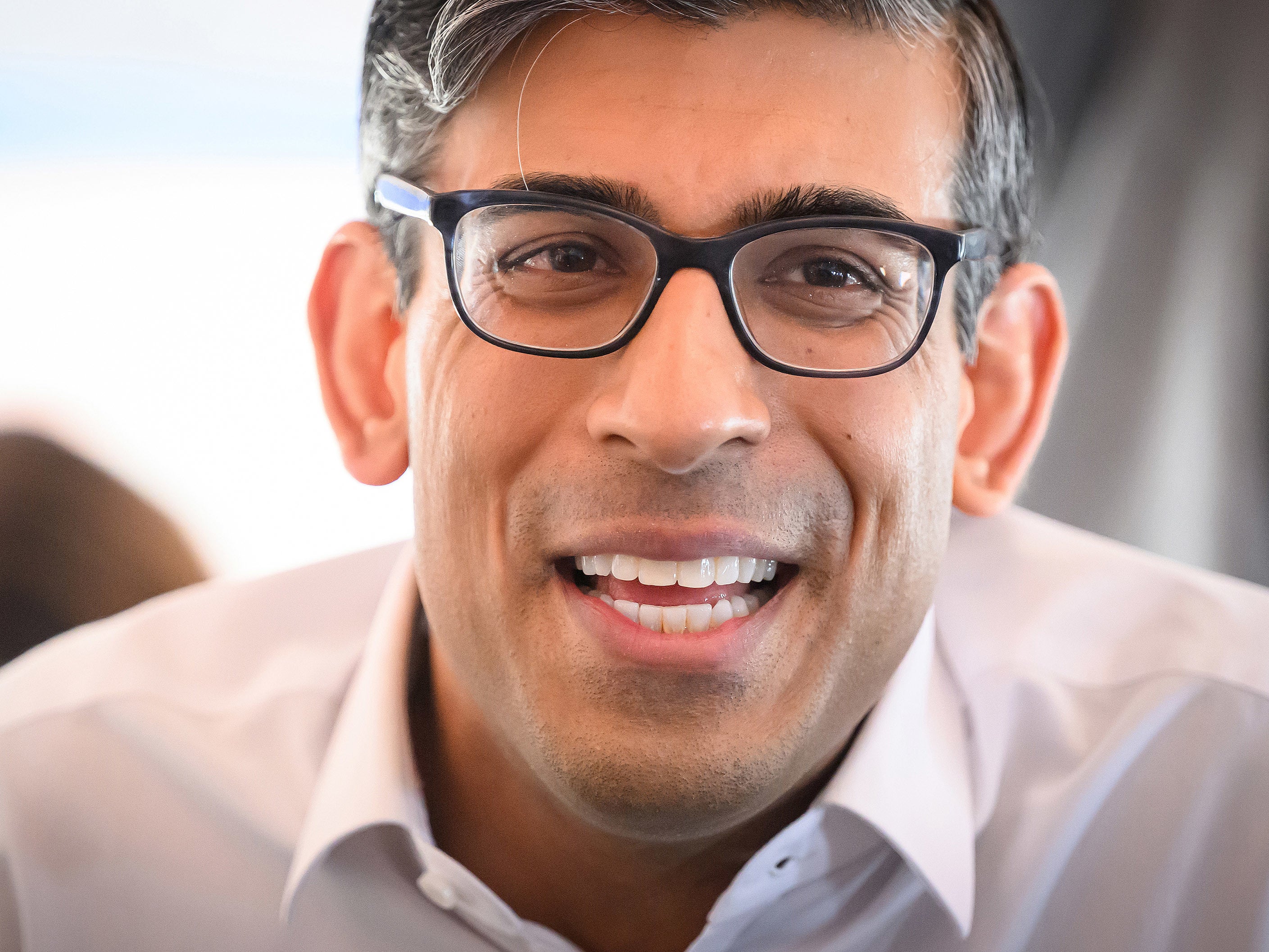 File photo: Rishi Sunak speaks to members of the travelling media during his flight to US