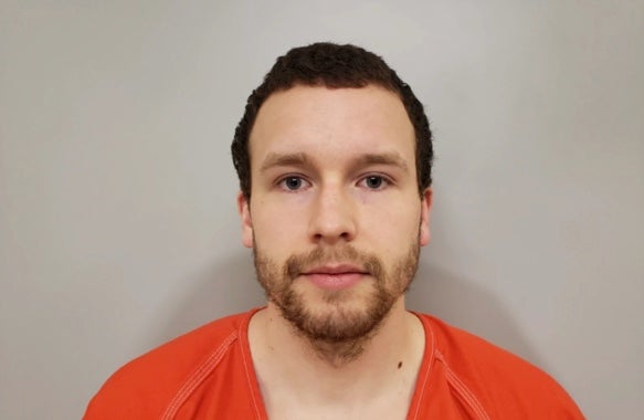 Levi Axtell, 27, (pictured in mugshot) allegedly beat Lawrence Scully, 77, more than a dozen times with a shovel before he ‘finished’ him off with the large pair of antlers