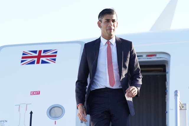 Rishi Sunak disembarks from his plane as he arrives in San Diego for the Aukus summit (Stefan Rousseau/PA)