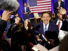 DeSantis poses with handmade snowflake sign with a hidden insult