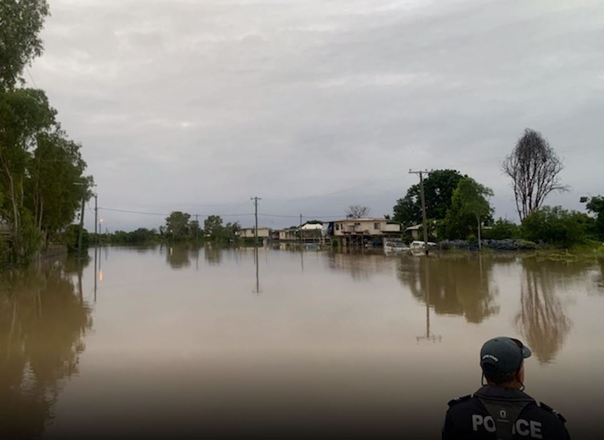 A minimum of 37 properties have succumbed to flood waters, with the majority of the 150-strong population evacuated to Doomadgee or Mt Isa