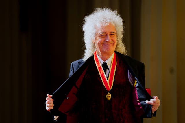 <p>Sir Brian May after being made a Knight Bachelor by the King at Buckingham Palace (Victoria Jones/PA)</p>
