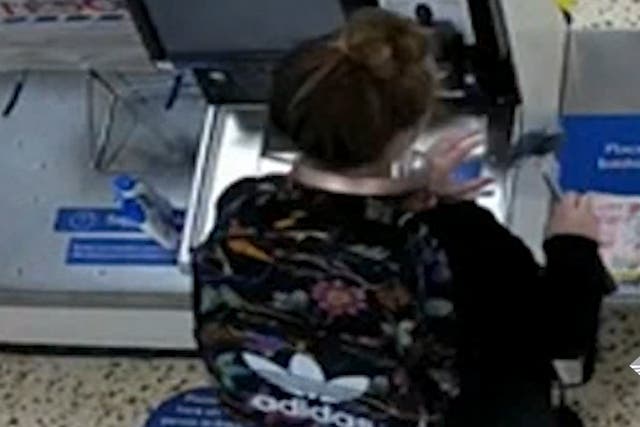 <p>Screen grab taken from undated CCTV issued by Cumbria Police showing Eleanor Williams purchasing a hammer in a branch of Tesco</p>