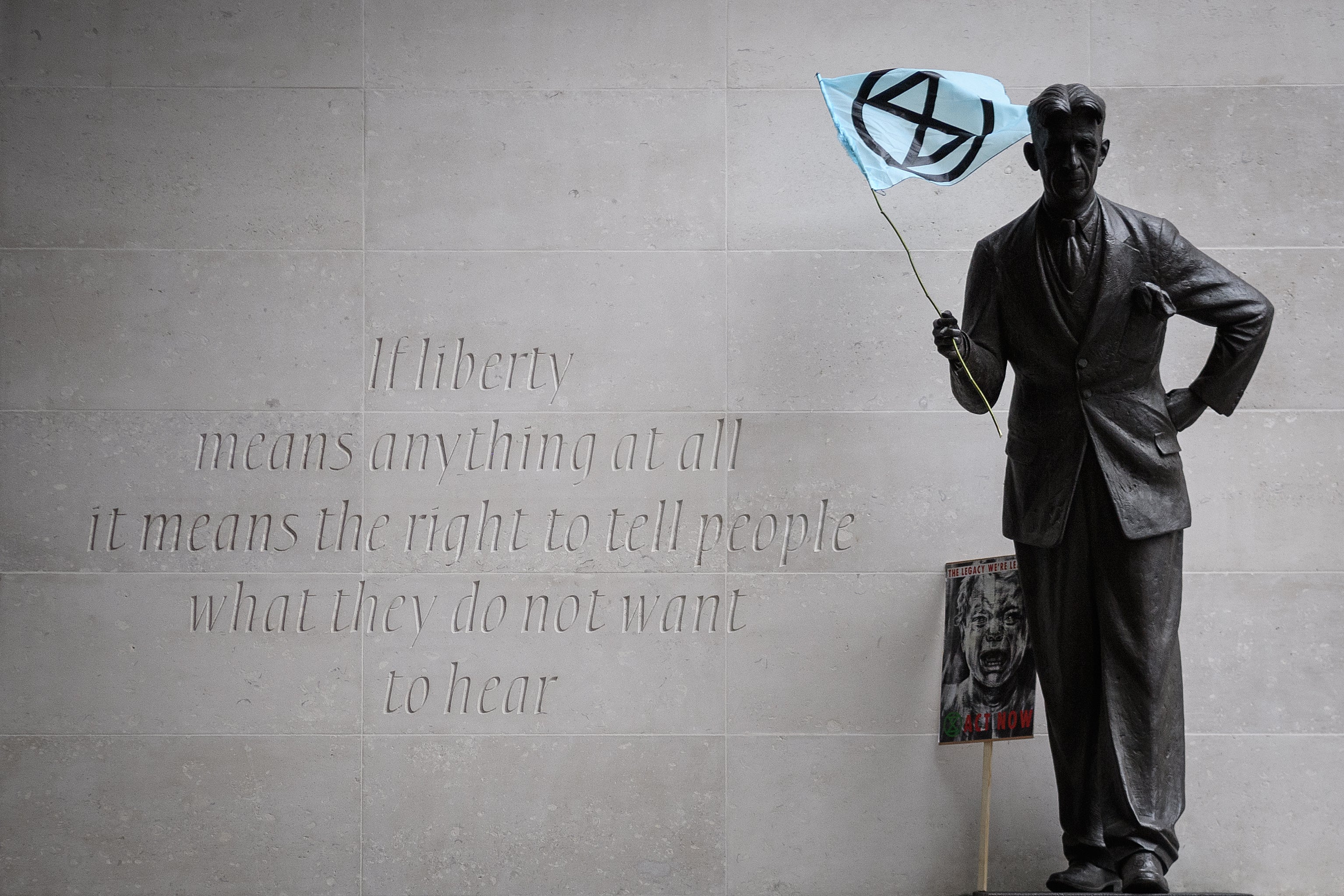 The George Orwell statue and quote was adorned with an Extinction Rebellion flag during the group’s mass protests in October 2019