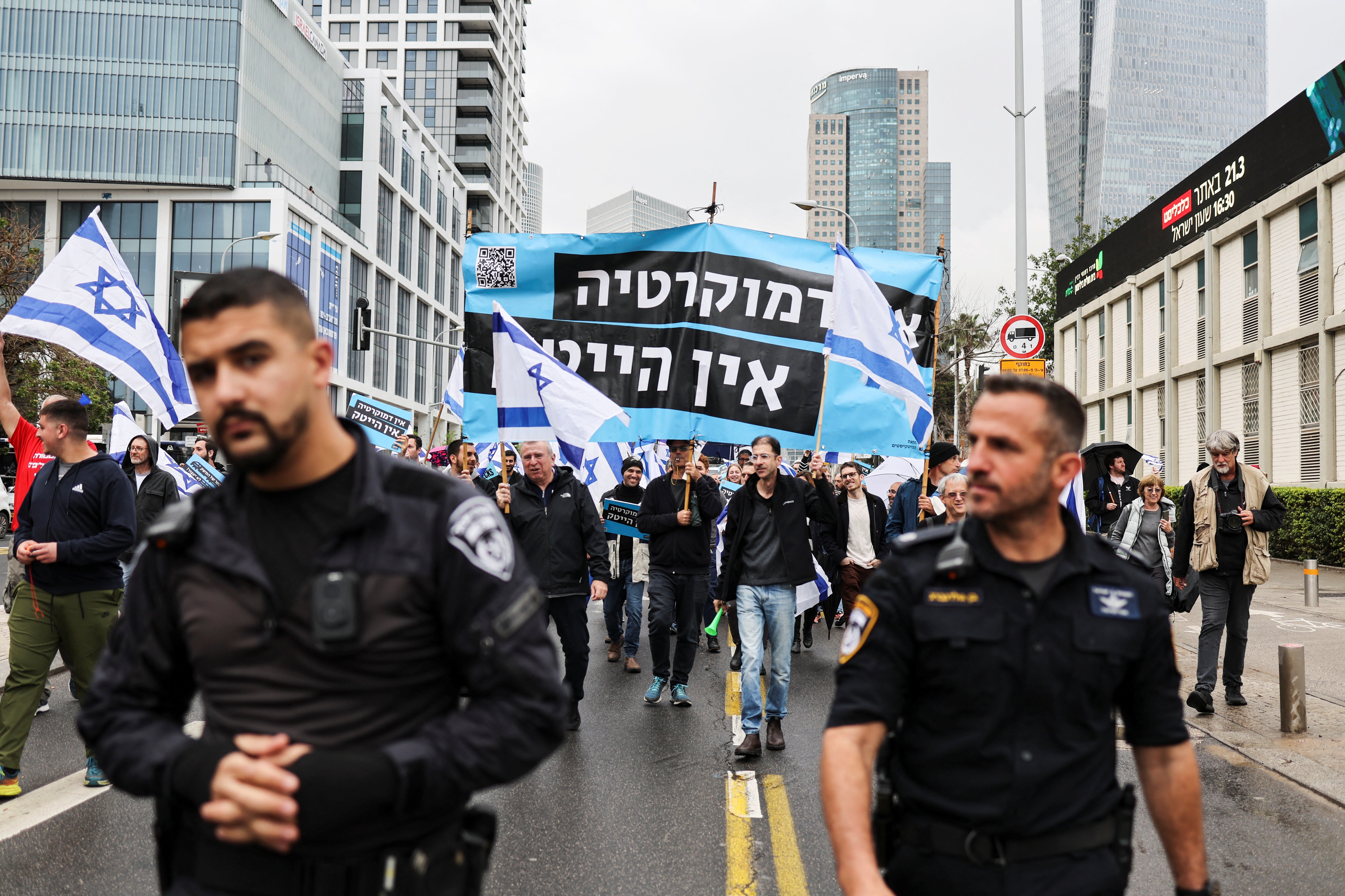 Police walk ahead of a demonstration in Tel Aviv on Tuesday against Netanyahu’s judicial overhaul