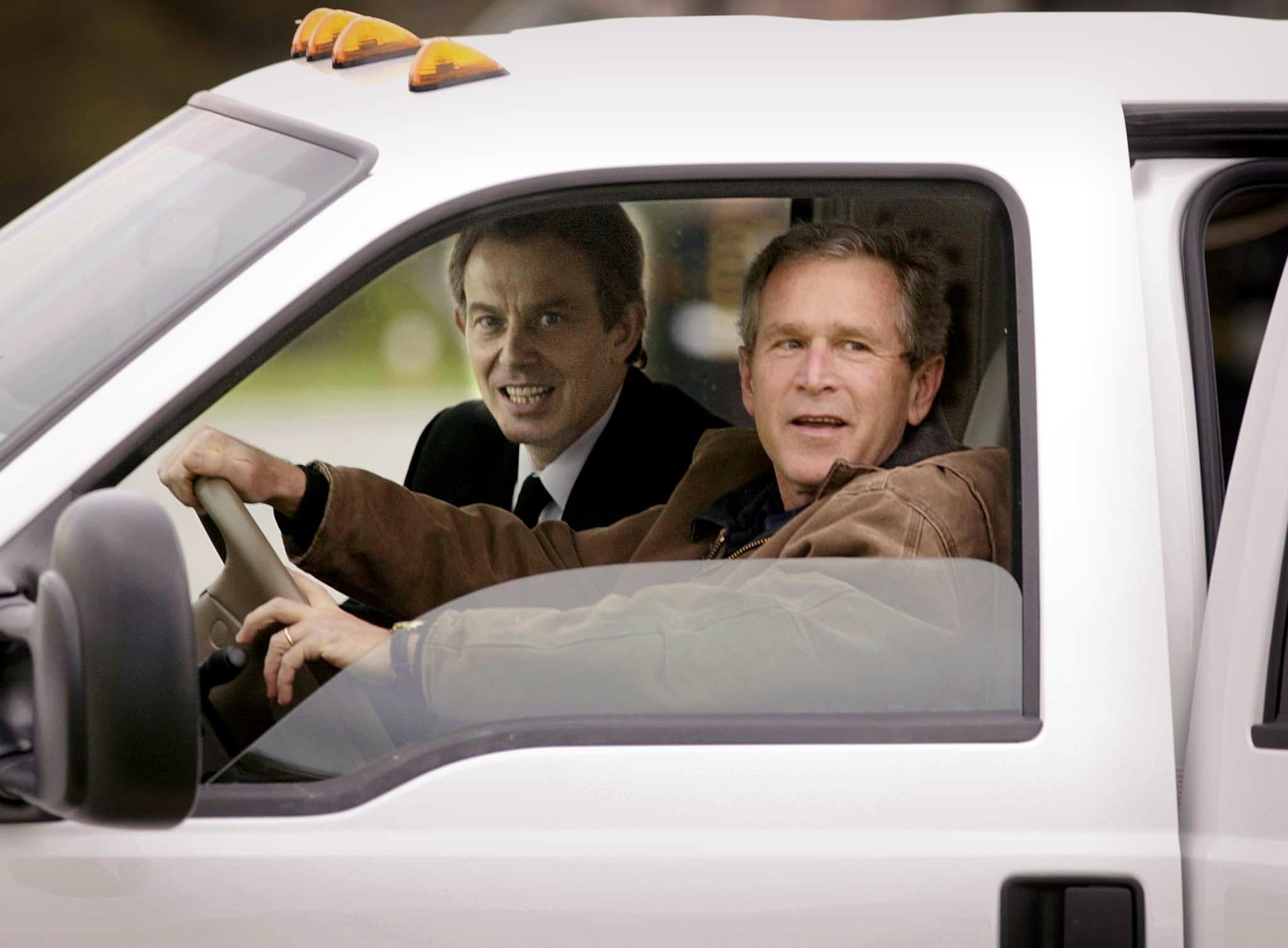 President George W Bush drives with Tony Blair on the ranch in Crawford, Texas