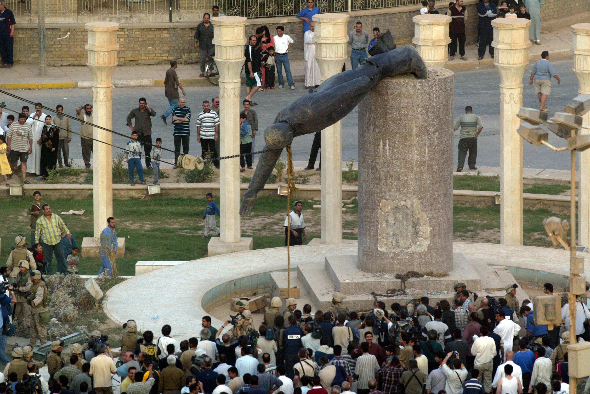 The statue of Saddam Hussein falls in Baghdad’s Fardus square