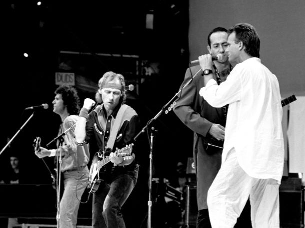 Dire Straits performing with Sting at Live Aid in 1985