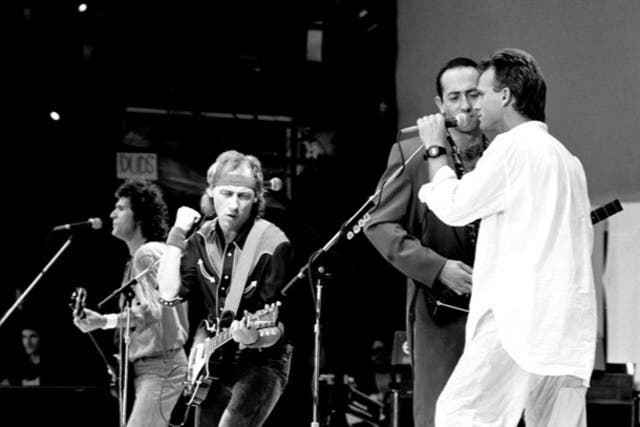 <p>Dire Straits performing with Sting at Live Aid in 1985</p>