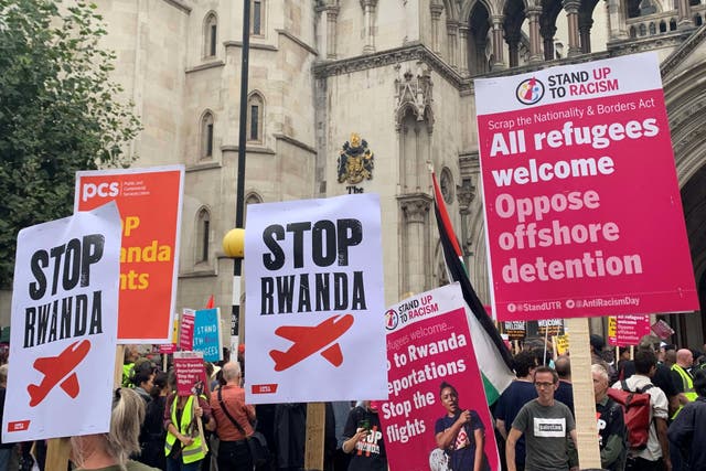 <p>Demonstrators outside the Royal Courts of Justice during the case against the Government’s plan to send some asylum seekers to Rwanda (Tom Pilgrim/PA)</p>