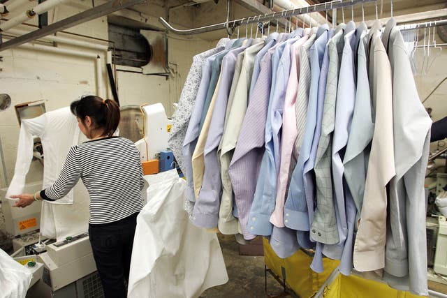 <p>A worker at Sohn’s French Cleaners, which uses eco-friendly chemicals to dry clean clothes</p>