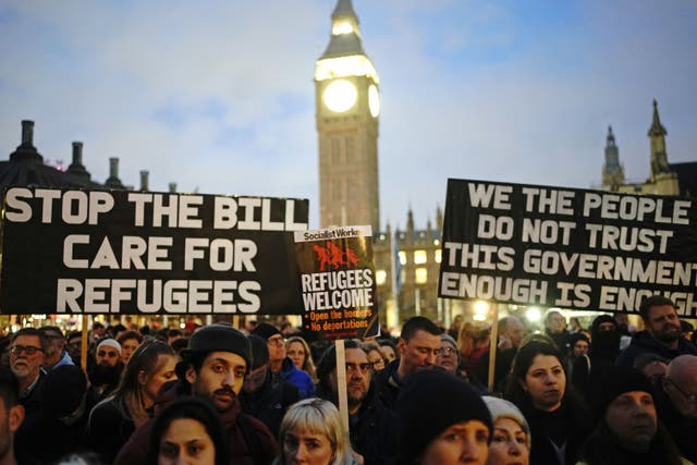 <p>Demonstrators protest against the Illegal Migration Bill in Parliament Square, London</p>