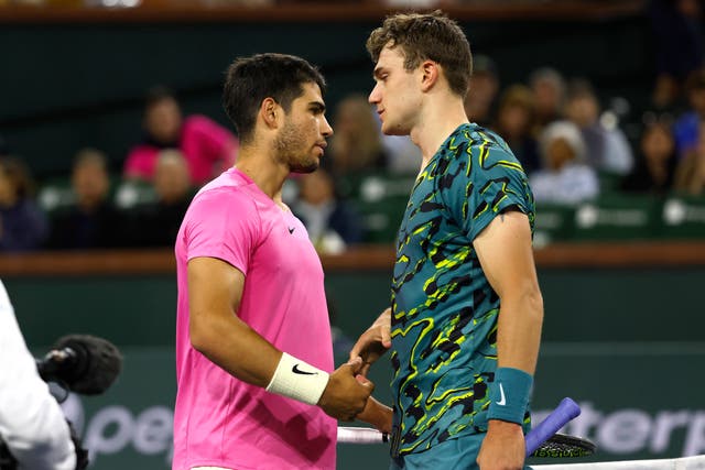 <p>Jack Draper, right, is consoled by Carlos Alcaraz at the net</p>