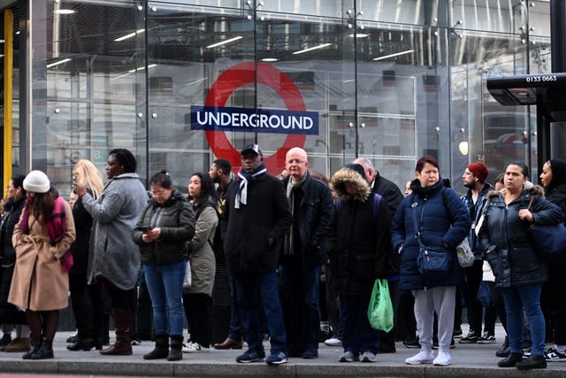 <p>People queue for buses outside Victoria train station in London on Wednesday 15 March </p>