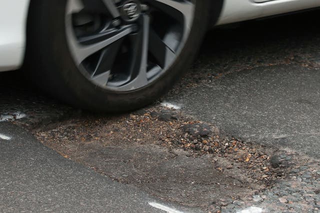 Chancellor Jeremy Hunt said funding to fix potholes across England will be boosted by £200 million (PA)