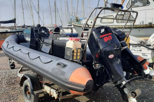 A boat which the NCA alleges was used in the people-smuggling runs was seized in Essex (National Crime Agency/PA)