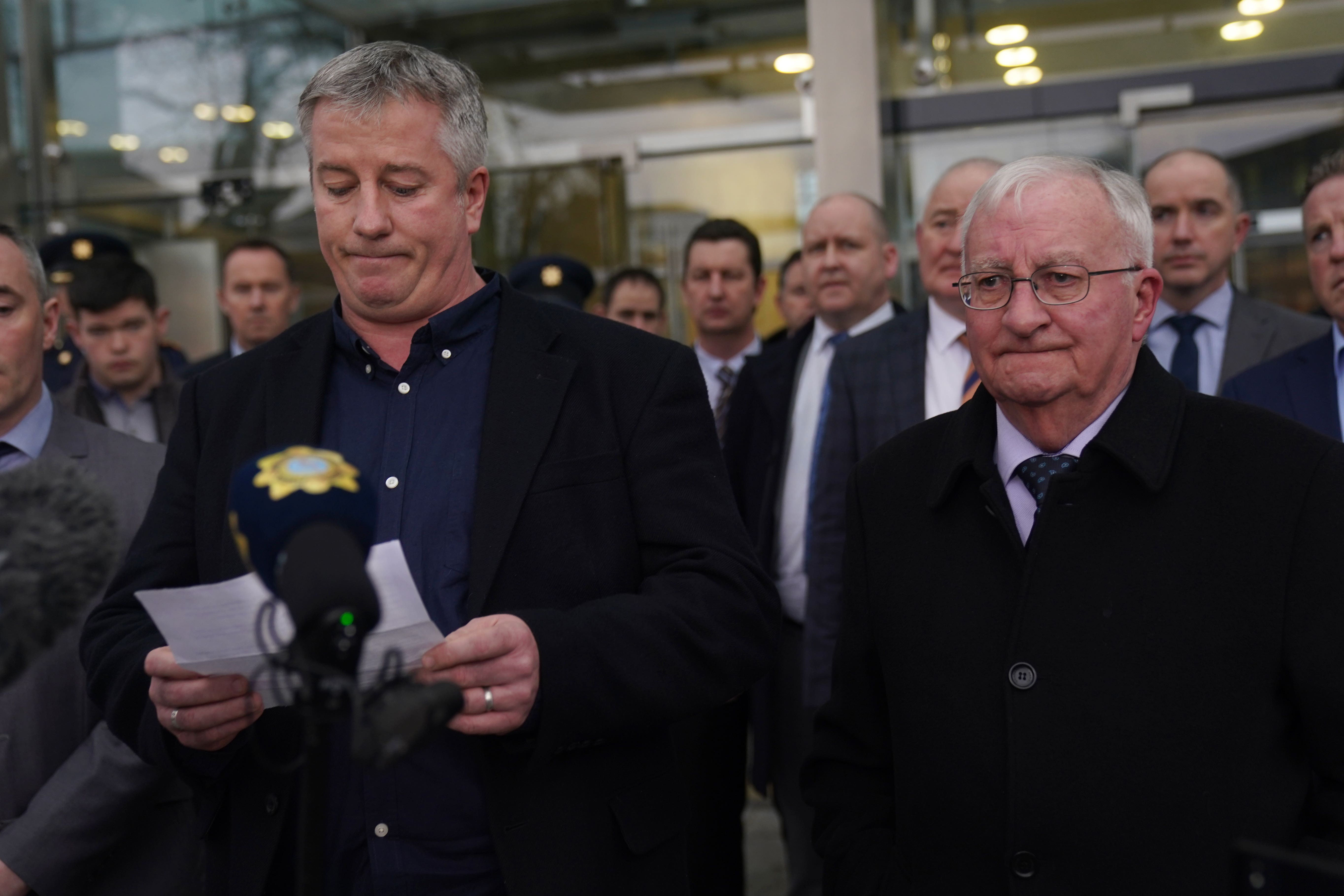 Brendan Horkan, left, brother of Colm Horkan makes a statement outside the Central Criminal Court (Brian Lawless/PA)