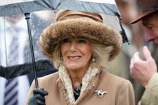 Queen Consort enjoys day at the races despite the drizzle