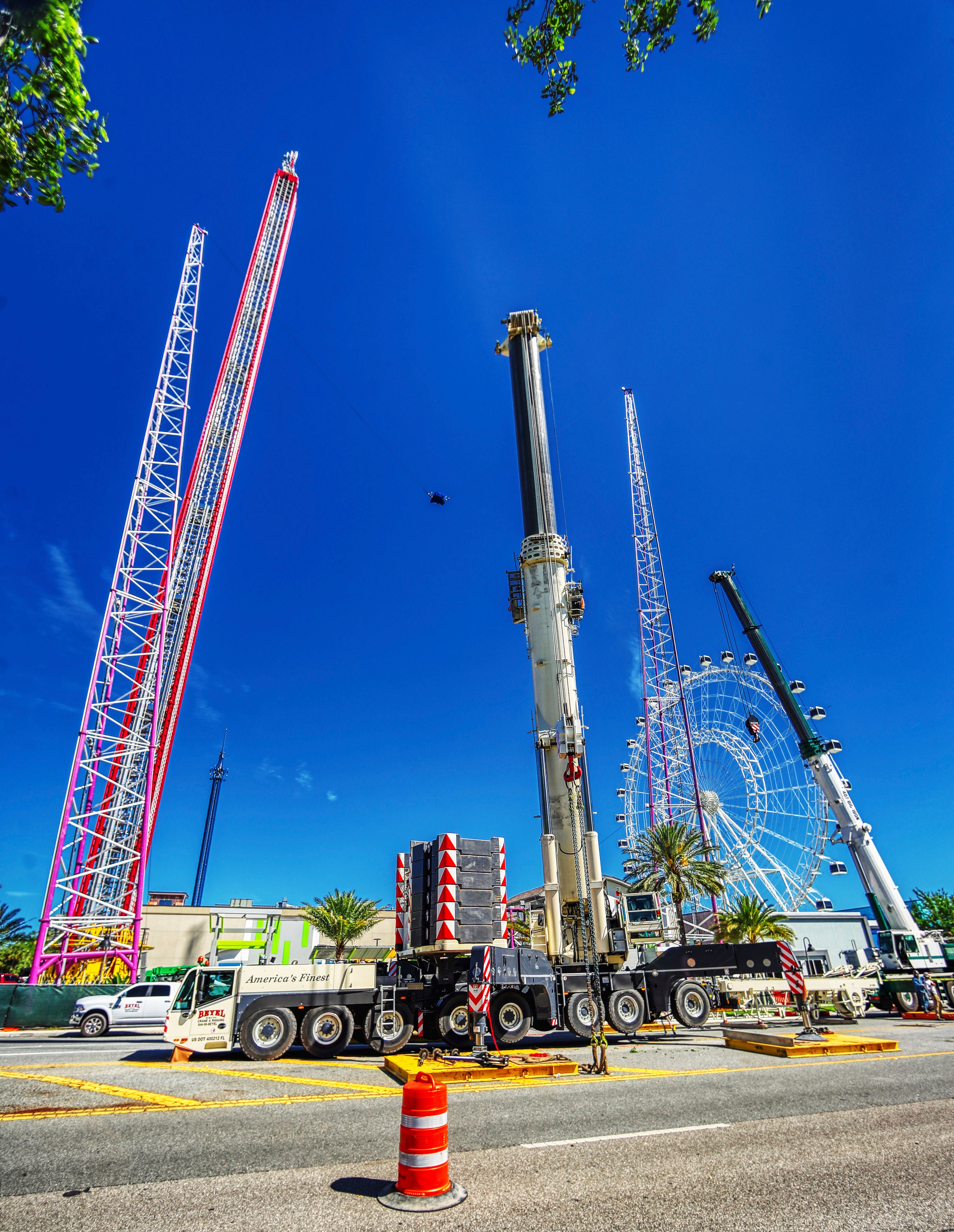 Work crews assemble the cranes that will be used to dismantle the Orlando FreeFall at ICON Park, on Tuesday, March 14