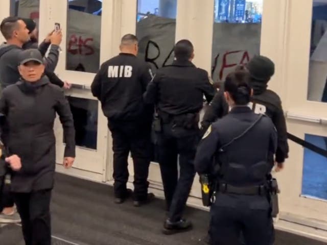 <p>Police block protesters from entering a building at UC Davis during a Charlie Kirk appearance</p>