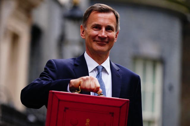 <p>Chancellor Jeremy Hunt leaves 11 Downing Street with his Budget red box (Victoria Jones/PA)</p>