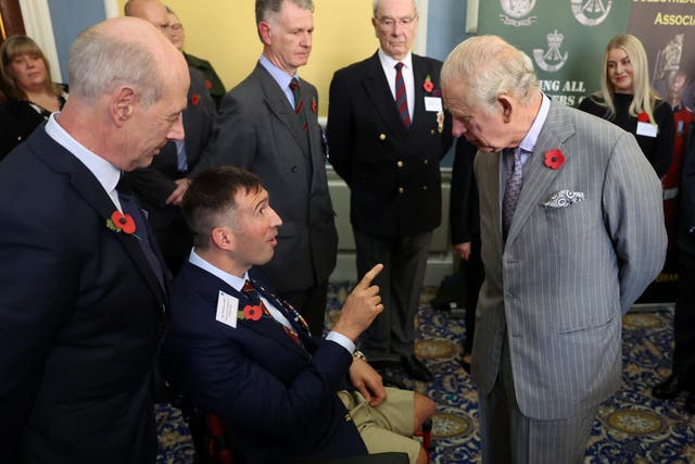 King Charles III speaks to Ben Parkinson, a former British paratrooper, during a ceremony at Mansion House to confer city status on Doncaster (PA)