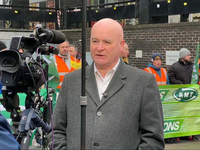 <p>Action station: Mick Lynch, general secretary of the RMT union. talking to Sky News at a picket line at London Euston</p>