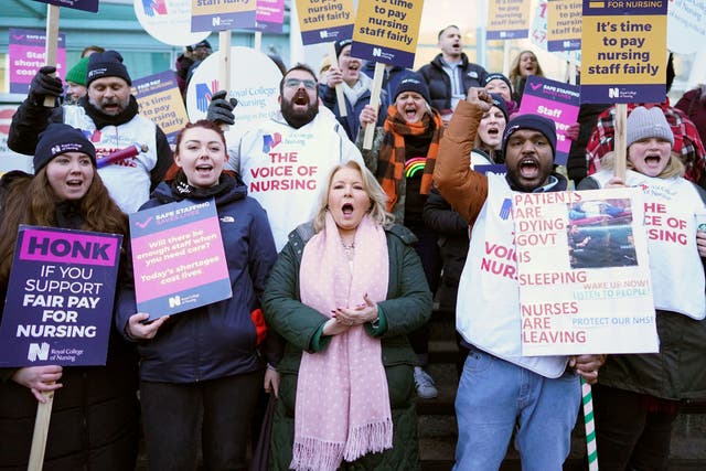 <p>Royal College of Nursing boss Pat Cullen (bottom row, centre) joins RCN members on the picket line outside University College Hospital, London, in January </p>