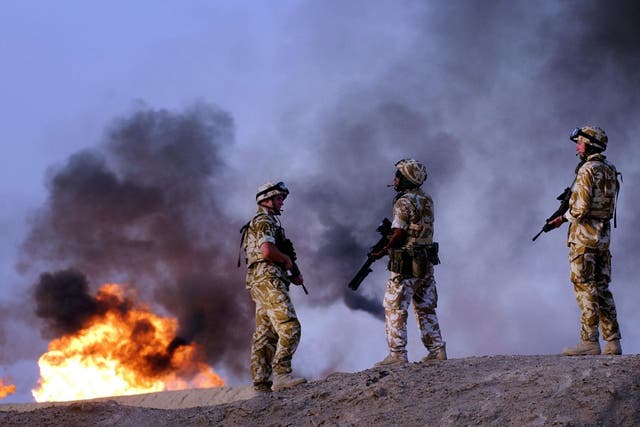 <p>British troops from the 2nd Battalion Light Infantry carry out an evening patrol targeting oil smugglers at a plant in Rauallah, Southern Iraq</p>