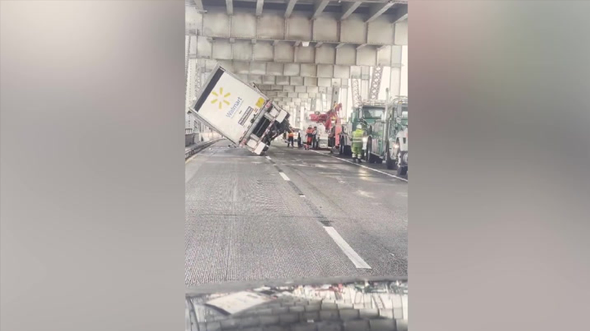 Overturned Walmart lorry pulled upright after being knocked by strong winds
