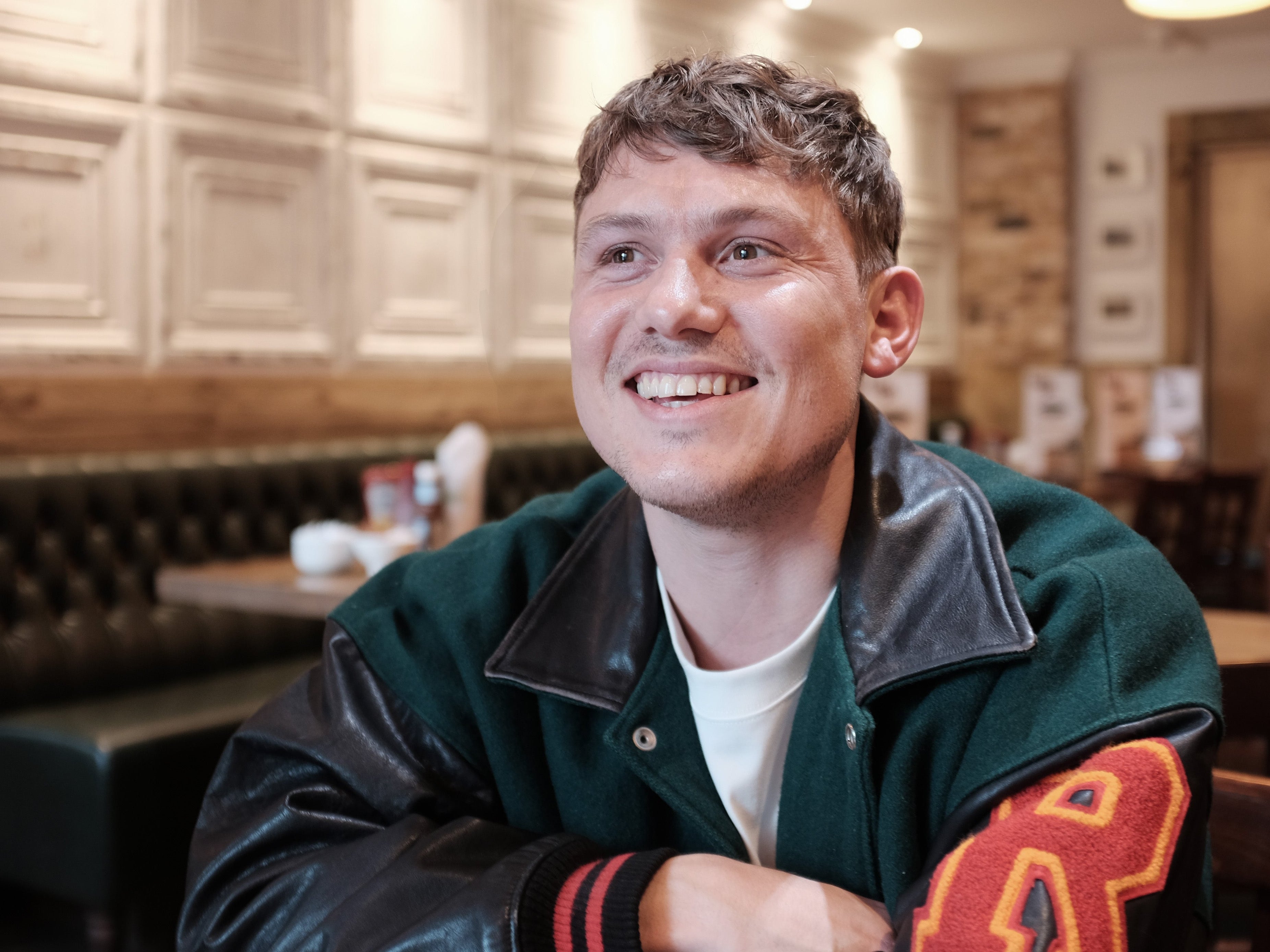 Jon Pointing in his local cafe in Lewisham