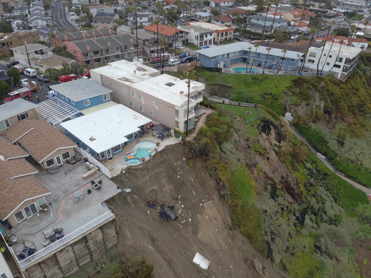 Pool dangles from California cliff after heavy rain sparks landslides