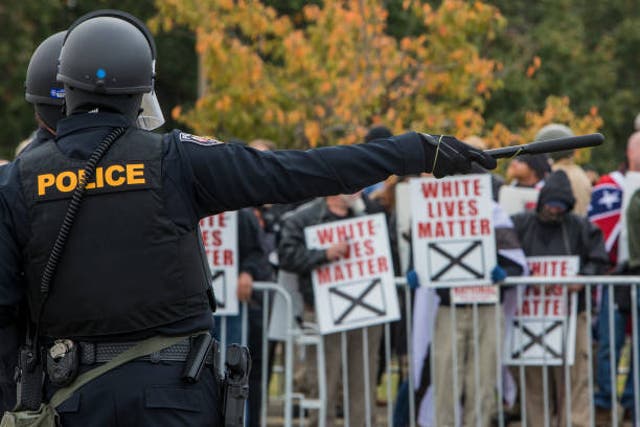 <p>Tennessee police are seen during a White Lives Matter rally</p>