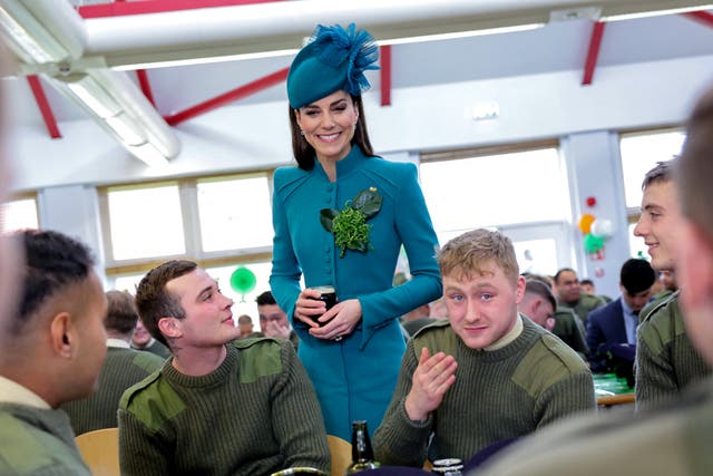 <p> Catherine, Princess of Wales meets with members of the Irish Guards and enjoys a glass of Guinness during the St. Patrick's Day Parade at Mons Barracks on March 17, 2023</p>