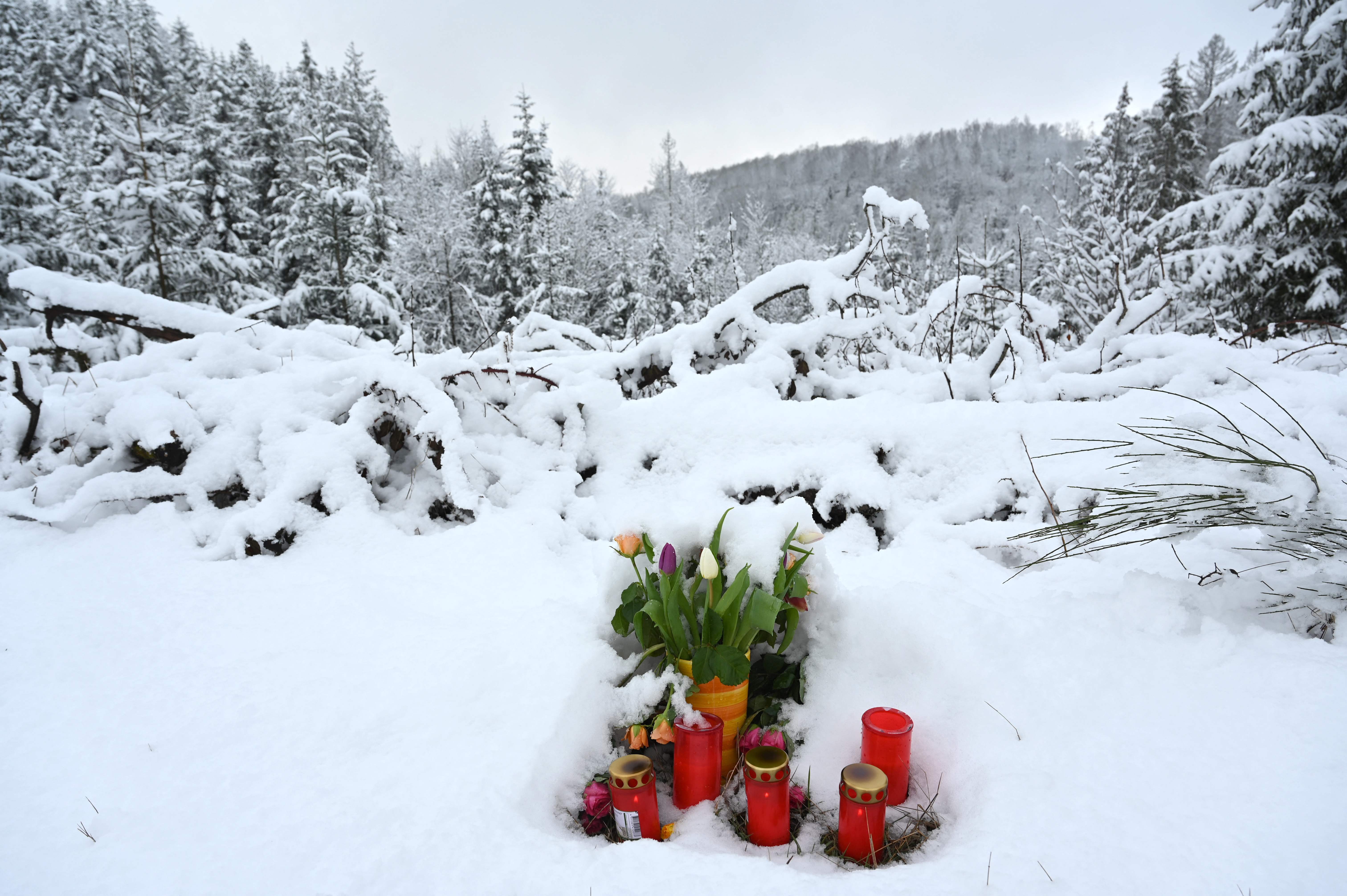 A makeshift memorial of flowers and candles is placed at the site where the body of Luise was found