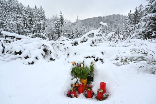 <p>A makeshift memorial of flowers and candles is placed at the site where the body of Luise was found</p>
