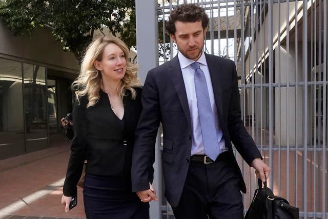 <p>Billy Evans leaves a California courthouse with Elizabeth Holmes </p>