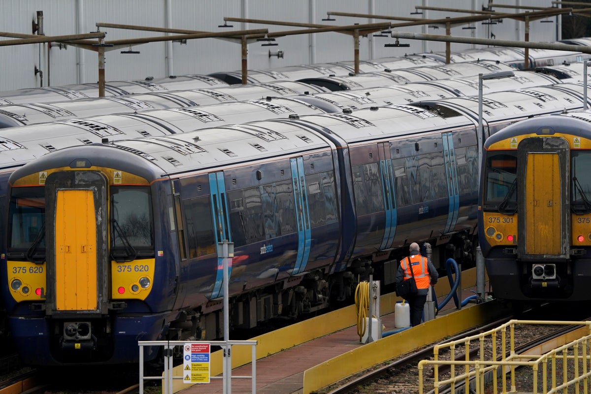 Train passengers face disruption as rail workers strike in pay and jobs row