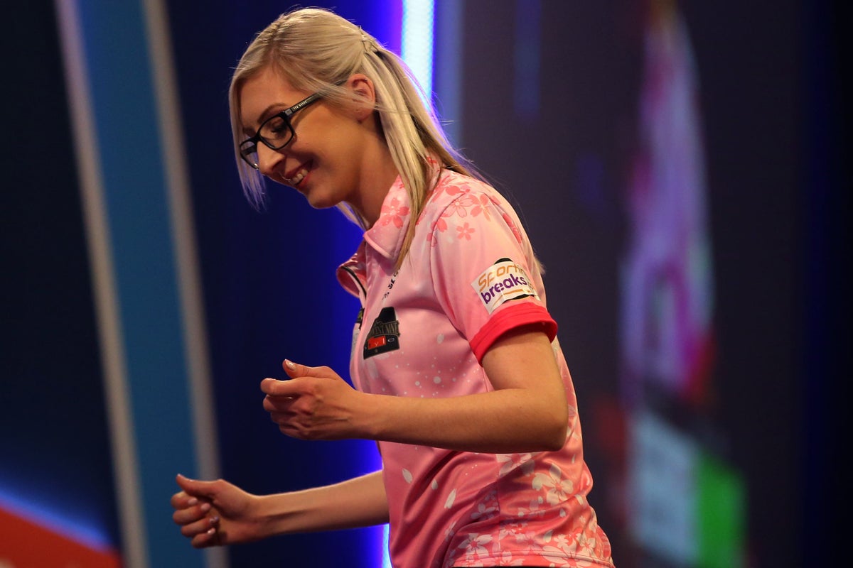 Fallon Sherrock becomes first woman to hit nine-dart finish in PDC event