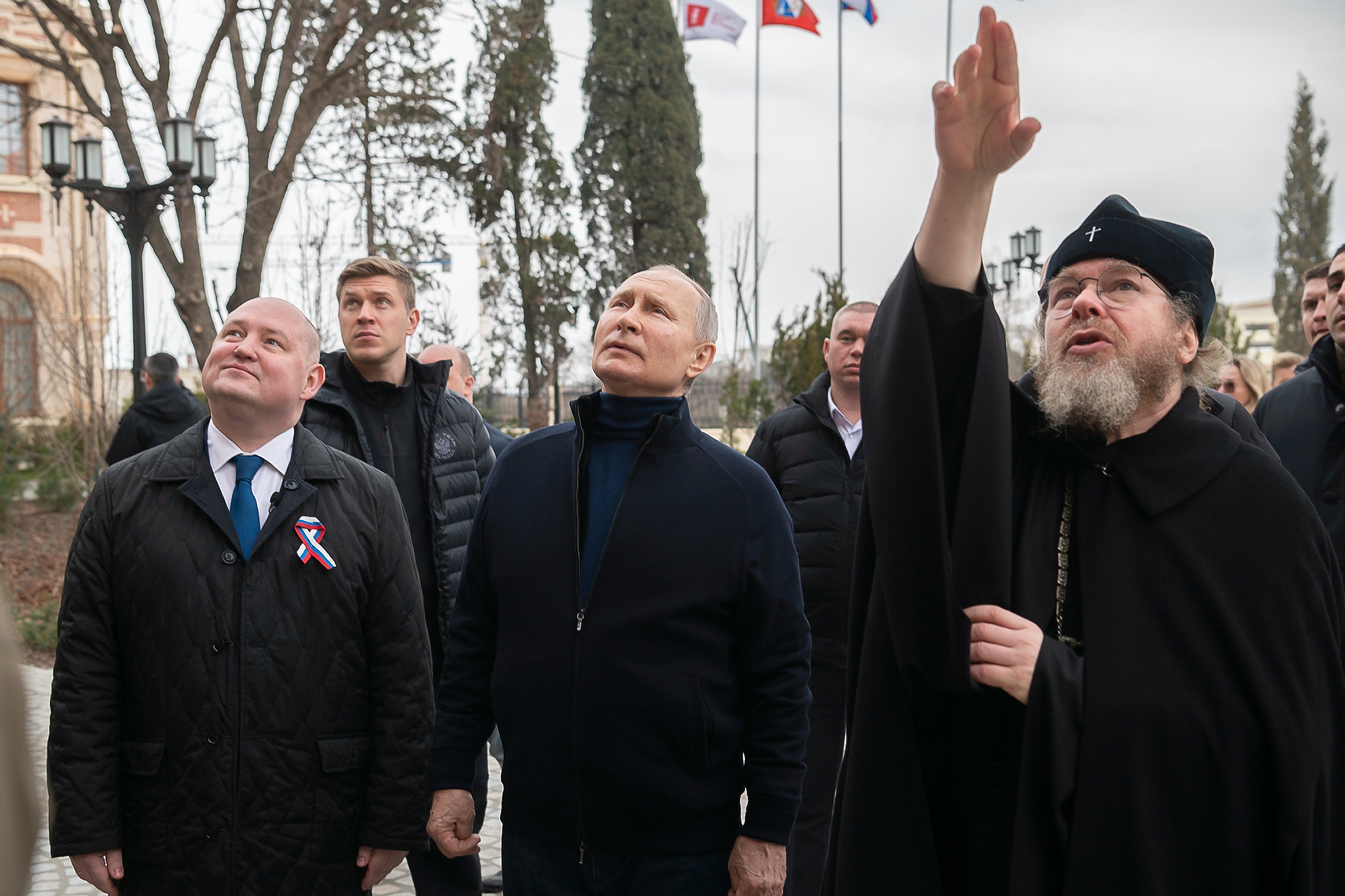 Vladimir Putin and Tikhon Shevkunov (right) have known each other for decades