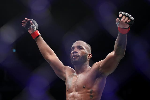 <p>Leon Edwards celebrates his victory over Kamaru Usman at the O” Arena in London (Kieran Cleeves/PA)</p>